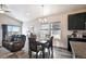 Open concept dining area with modern finishes and ample natural light at 98 Chipeta Way, Lochbuie, CO 80603