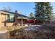 Brick home with covered patio and spacious backyard at 1475 Monaco Pkwy, Denver, CO 80220