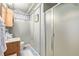 Basement bathroom with shower, toilet, and sink at 1475 Monaco Pkwy, Denver, CO 80220