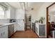 Modern kitchen with white cabinets and stainless steel appliances at 1475 Monaco Pkwy, Denver, CO 80220