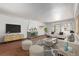 Living room featuring a fireplace and stylish furniture at 1475 Monaco Pkwy, Denver, CO 80220