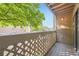Balcony view with lush foliage, lattice railing, and wooden deck in peaceful outdoor setting at 12368 W Nevada Pl # 206, Lakewood, CO 80228