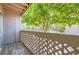 Balcony view with lush foliage, lattice railing, and wooden deck in peaceful outdoor setting at 12368 W Nevada Pl # 206, Lakewood, CO 80228