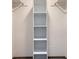 The closet has a tall shelf with 6 open storage spots to store clothes and items at 12368 W Nevada Pl # 206, Lakewood, CO 80228