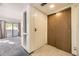 Bright entryway features tile floors, a closet, and opens to a living area with sliding glass doors and a balcony at 12368 W Nevada Pl # 206, Lakewood, CO 80228