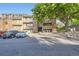 A charming multi-story condo complex features balconies, well-maintained landscaping, and convenient parking at 12368 W Nevada Pl # 206, Lakewood, CO 80228
