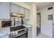Updated kitchen featuring sleek stainless steel appliances and light cabinets with granite countertops at 12368 W Nevada Pl # 206, Lakewood, CO 80228