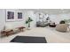 Finished basement with a light grey sectional sofa, art and neutral carpet at 9455 W 37Th Ave, Wheat Ridge, CO 80033
