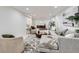 Finished basement with plush seating, a round coffee table and unique artwork at 9455 W 37Th Ave, Wheat Ridge, CO 80033