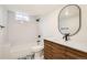 Elegant bathroom featuring a modern vanity, subway tile shower, and stylish fixtures at 9455 W 37Th Ave, Wheat Ridge, CO 80033