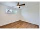 Empty bedroom showcasing hardwood floors, white trim, and abundant natural light at 9455 W 37Th Ave, Wheat Ridge, CO 80033