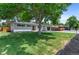 Charming home featuring a well-manicured lawn and mature shade trees at 9455 W 37Th Ave, Wheat Ridge, CO 80033