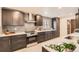 Modern kitchen boasts sleek cabinetry, stainless steel appliances, and quartz countertops at 9455 W 37Th Ave, Wheat Ridge, CO 80033
