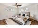 Serene bedroom with hardwood floors, light gray walls, and a plush bed with neutral-toned bedding at 9455 W 37Th Ave, Wheat Ridge, CO 80033
