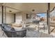 Covered patio featuring lounge seating and dining space, perfect for outdoor entertaining at 9455 W 37Th Ave, Wheat Ridge, CO 80033