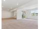 Spacious unfinished basement with plush carpet, white walls, and a sliding door to outside at 8346 Cokedale Cir, Littleton, CO 80125