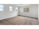 Bedroom with plush carpet, white walls, and multiple windows providing lots of natural light at 8346 Cokedale Cir, Littleton, CO 80125