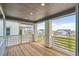 Outdoor patio with wooden flooring, brick supports, and a beautiful neighborhood view at 8346 Cokedale Cir, Littleton, CO 80125