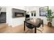 Elegant dining room with modern fireplace, stylish decor, and ample natural light at 3727 Tejon St, Denver, CO 80211