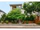 Modern home with a two-story facade, landscaped front yard, and contemporary architectural details at 3727 Tejon St, Denver, CO 80211