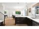 Bright, open-concept kitchen with sleek cabinetry, marble countertops, and stainless steel appliances at 3727 Tejon St, Denver, CO 80211