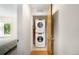 Convenient laundry closet featuring a stacked washer and dryer unit at 3727 Tejon St, Denver, CO 80211