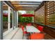 Outdoor patio area with wood pergola, dining set, and vibrant red umbrella at 3727 Tejon St, Denver, CO 80211
