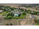 Aerial view of a luxurious home on 1.91 acres with a pool and gazebo at 17575 E Kettle Pl, Centennial, CO 80016