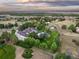 Luxury home aerial view, showcasing a large estate with pool and lush landscaping at 17575 E Kettle Pl, Centennial, CO 80016