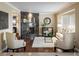 Bright living room with a marble fireplace and bay window at 17575 E Kettle Pl, Centennial, CO 80016