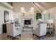 Elegant living room featuring a fireplace and comfortable seating at 17575 E Kettle Pl, Centennial, CO 80016