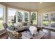 Bright sunroom features hardwood floors and ample natural light at 17575 E Kettle Pl, Centennial, CO 80016