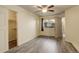 Bright bedroom featuring updated vinyl flooring, ceiling fan, and access to the closet at 1820 Newland Ct # 213, Lakewood, CO 80214