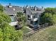 Townhome exterior featuring balconies, a fenced yard, and lush landscaping for privacy at 1820 Newland Ct # 213, Lakewood, CO 80214
