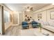 Relaxing living room with a modern work space, light wood floors, and a comfortable seating arrangement at 1820 Newland Ct # 213, Lakewood, CO 80214