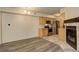Bright living room and kitchen featuring stainless steel appliances and cozy fireplace at 1820 Newland Ct # 213, Lakewood, CO 80214
