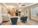 A stylish living space with fireplace, and open layout into kitchen and through to the bedroom at 1820 Newland Ct # 213, Lakewood, CO 80214
