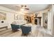 Inviting living room with fireplace, modern furnishings, and seamless flow into the adjacent kitchen at 1820 Newland Ct # 213, Lakewood, CO 80214