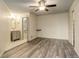 Spacious main bedroom features vinyl floors, and an adjacent bathroom, and large closet at 1820 Newland Ct # 213, Lakewood, CO 80214