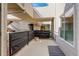 A covered patio with a small potted plant and patio rug is perfect for enjoying the outdoors at 1820 Newland Ct # 213, Lakewood, CO 80214