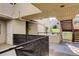 A covered patio with railing offers a comfortable outdoor space with easy access to the exterior stairs at 1820 Newland Ct # 213, Lakewood, CO 80214