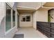 A covered patio with windows and doors offers a seamless transition between indoor and outdoor living at 1820 Newland Ct # 213, Lakewood, CO 80214