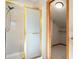Bathroom featuring standing shower with glass door and an entrance to the walk-in closet at 2245 Ridgeview Way, Longmont, CO 80504