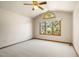Empty bedroom featuring plush carpet, vaulted ceiling and a large window that provides lots of light at 2245 Ridgeview Way, Longmont, CO 80504
