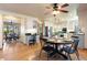 Dining area with hardwood floors, chandelier, and view of kitchen and living room at 2245 Ridgeview Way, Longmont, CO 80504