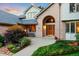 Inviting home entrance with well-maintained landscaping and a cozy bench, perfect for enjoying the outdoors at 2245 Ridgeview Way, Longmont, CO 80504