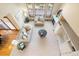 Aerial view of a spacious living room features a cozy fireplace, built-in shelving, and comfortable seating arrangement at 2245 Ridgeview Way, Longmont, CO 80504