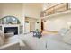 Spacious living room with fireplace, built-ins, and large arched window providing ample natural light at 2245 Ridgeview Way, Longmont, CO 80504