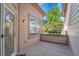 View of a back patio space next to manicured backyard landscaping at 14333 E Napa Pl # 5D, Aurora, CO 80014