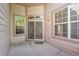Inviting back patio area with sliding glass doors that offers seamless indoor-outdoor living at 14333 E Napa Pl # 5D, Aurora, CO 80014